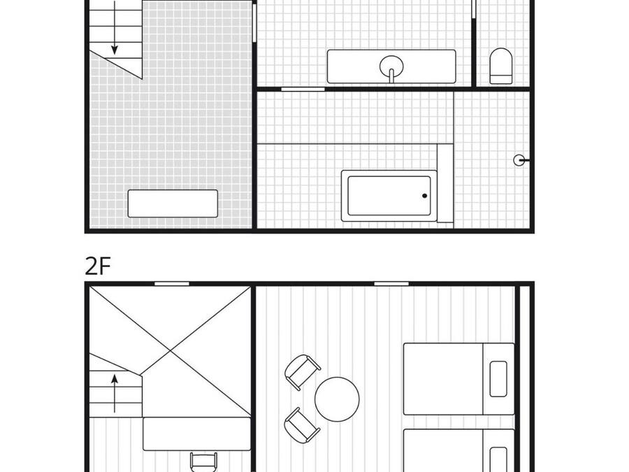 A floor plan of a hotel room with a bathroom, a kitchenette, and a seating area.