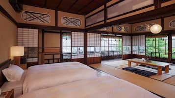 Grand fyrbäddsrum | Minibar och gratis wi-fi