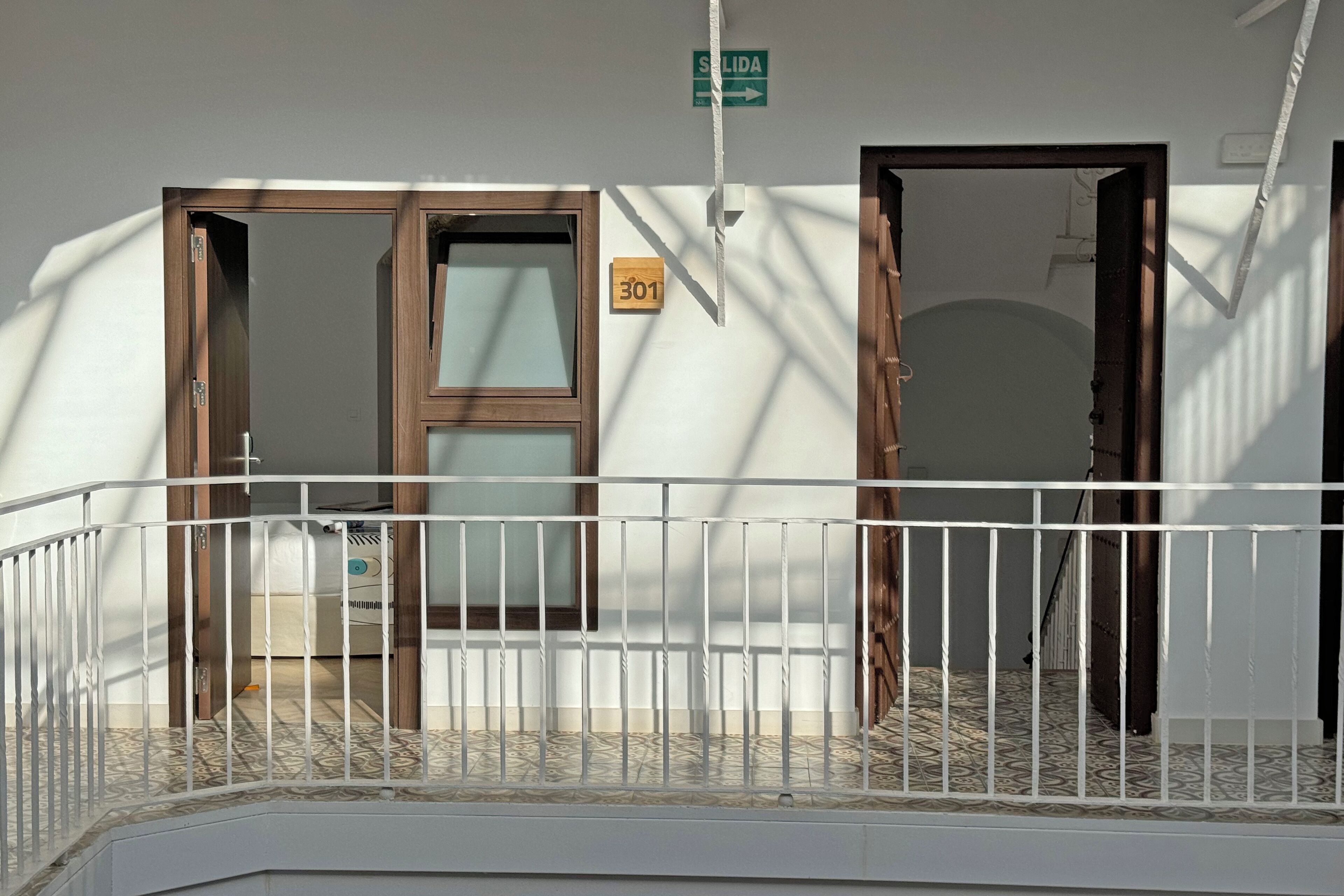 desk, laptop workspace, blackout curtains, iron/ironing board