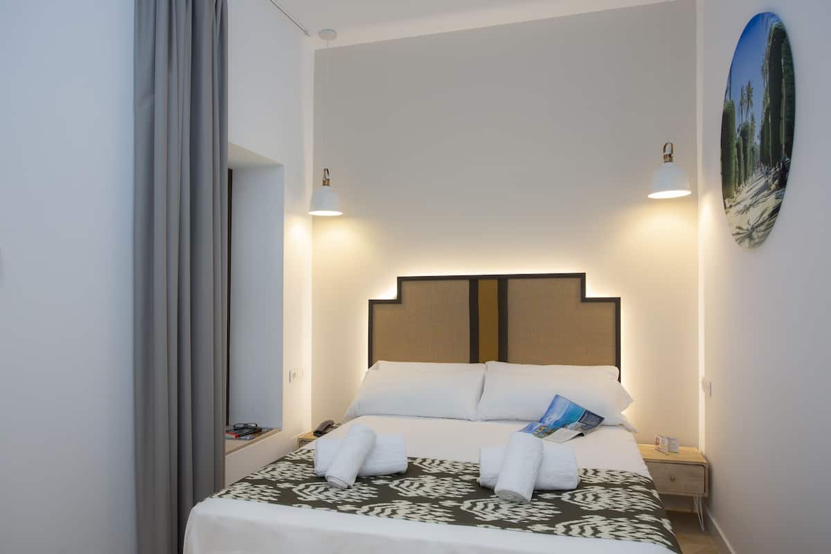 desk, laptop workspace, blackout curtains, iron/ironing board