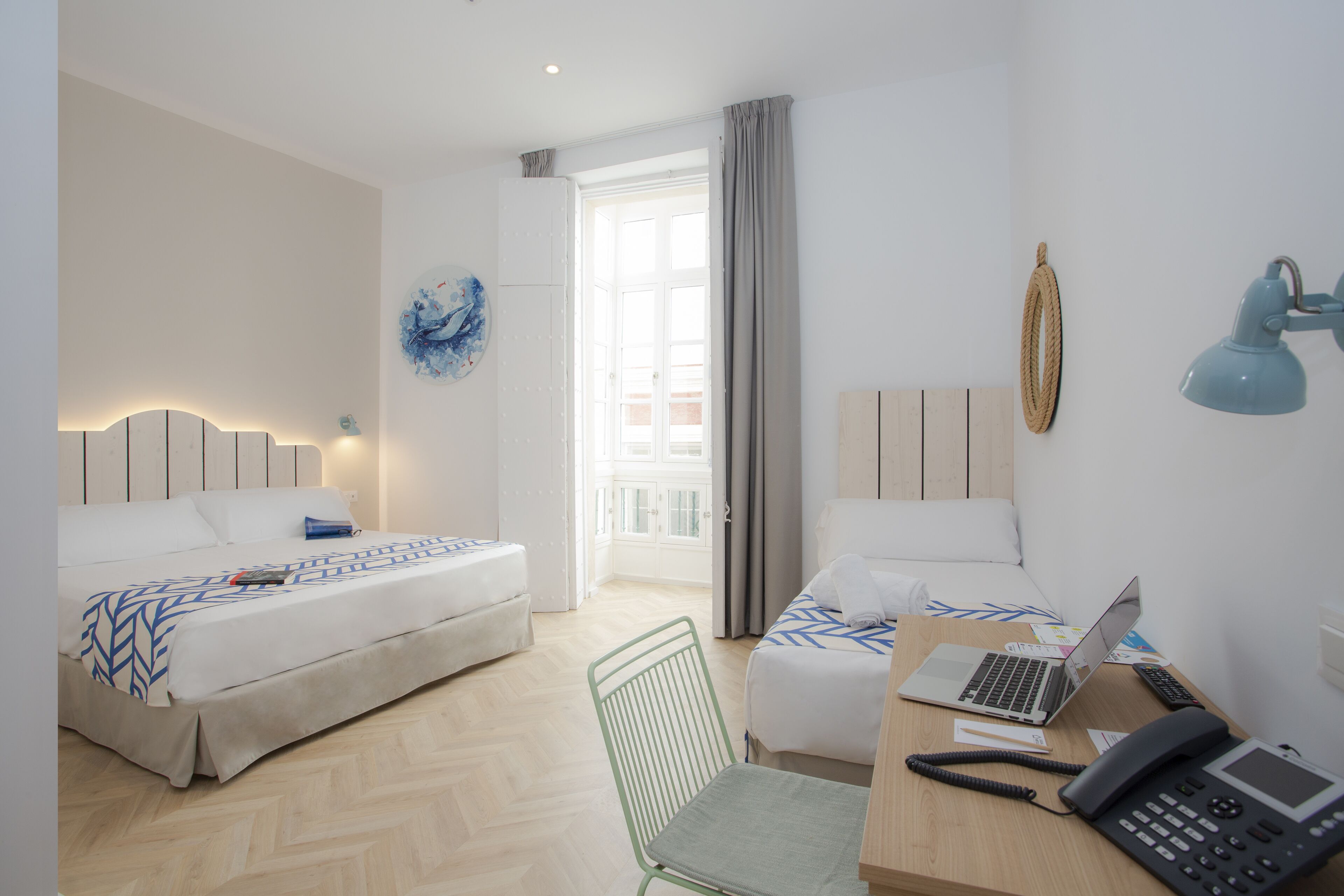 triple room, balcony | desk, laptop workspace, blackout curtains, iron/ironing board