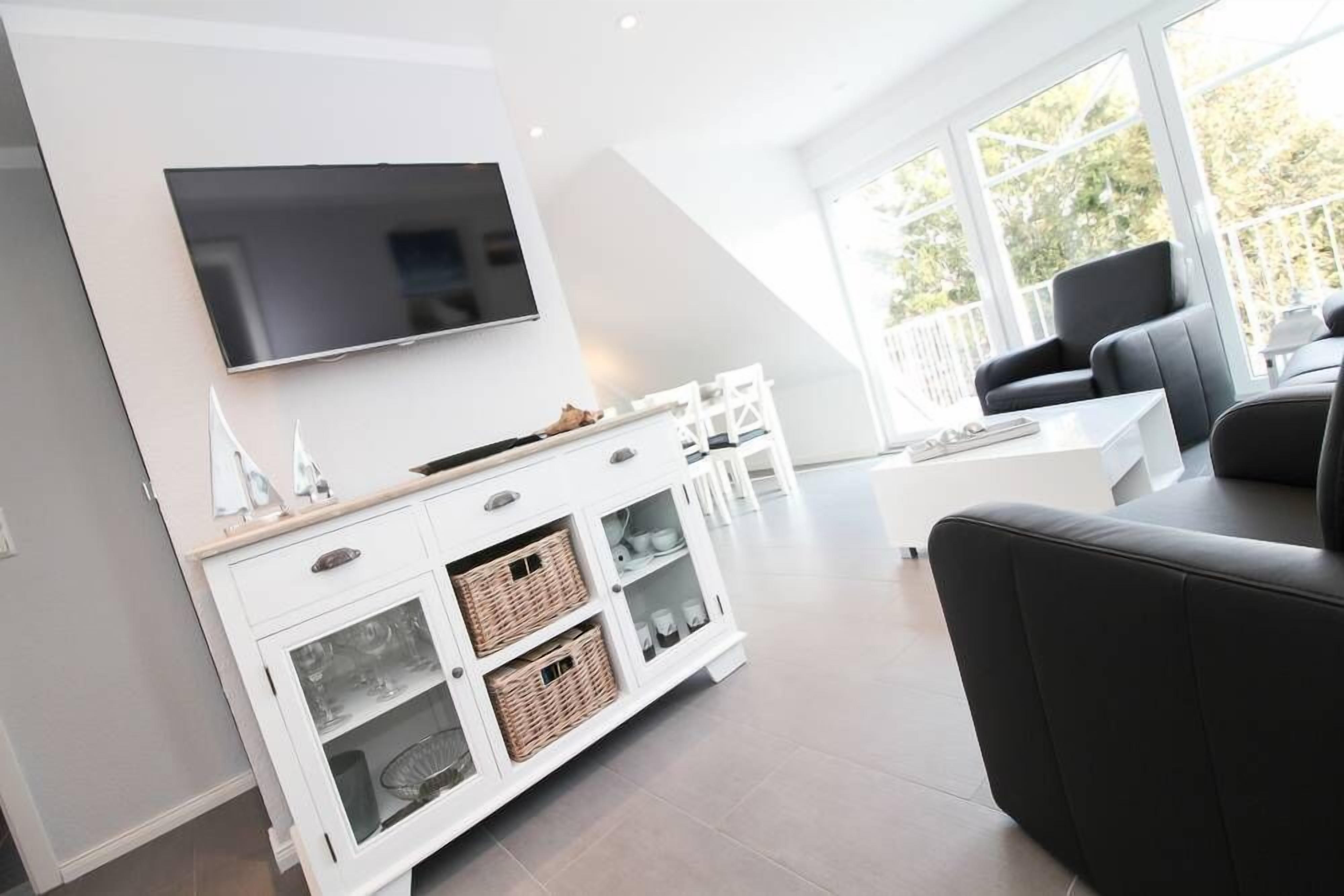 Apartamento, 2 quartos | Área de estar | TV de tela plana