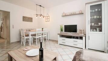 Apartment, 2 Bedrooms, Terrace | Living room | Flat-screen TV, streaming services