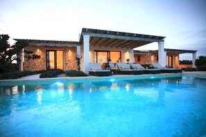 Enjoy a pool and outdoor seating area.