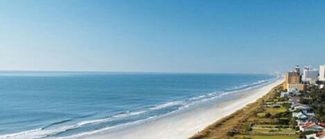 On the beach, sun-loungers, beach towels