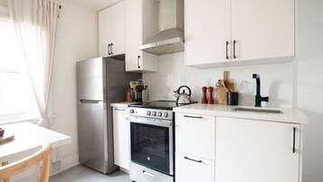 Fridge, oven, coffee/tea maker, cookware/dishes/utensils