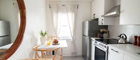 Fridge, oven, coffee/tea maker, cookware/dishes/utensils