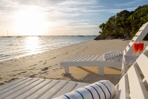 On the beach, sun loungers, beach umbrellas, beach towels
