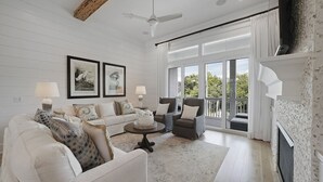 House, Multiple Beds | Living room | TV, fireplace, table football - Family Traditions by Five Star Properties (Santa Rosa Beach)