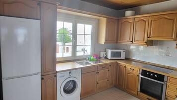 Superior Apartment, 2 Bedrooms, Balcony | Private kitchen | Full-sized fridge, microwave, oven, stovetop