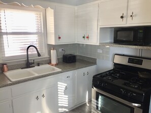 Fridge, microwave, oven, stovetop - Retro-Chic Urban Oasis (Chicago)