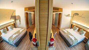 A mirrored room with two beds, wooden headboards, and a central wooden structure.