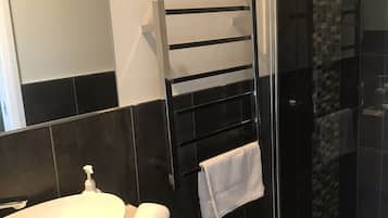 Shower, eco-friendly toiletries, hair dryer, towels