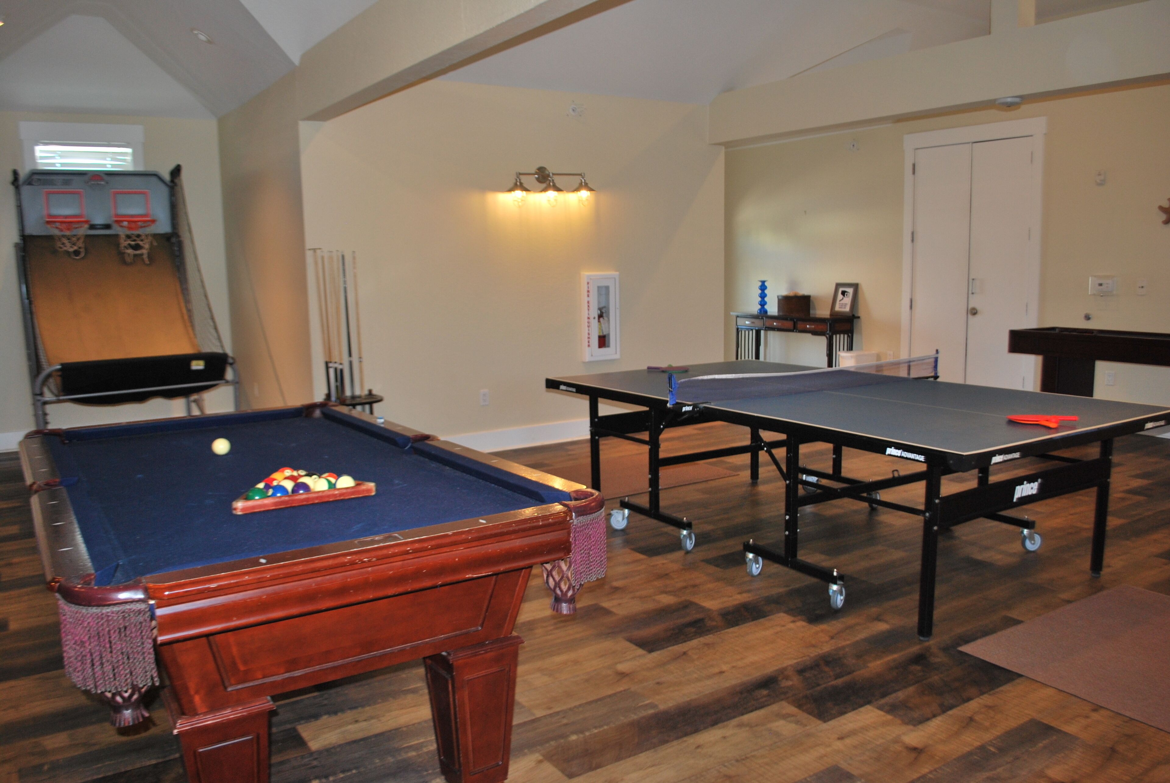 Ping pong, pool, basketball game and more await you in the game room.