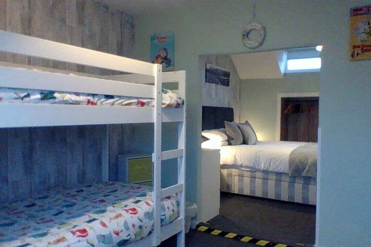 Family Quadruple Room, 1 Bedroom | 2 bedrooms, individually decorated, iron/ironing board, free WiFi