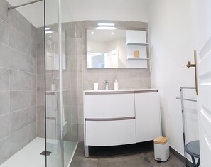 Shower, hair dryer, towels, soap