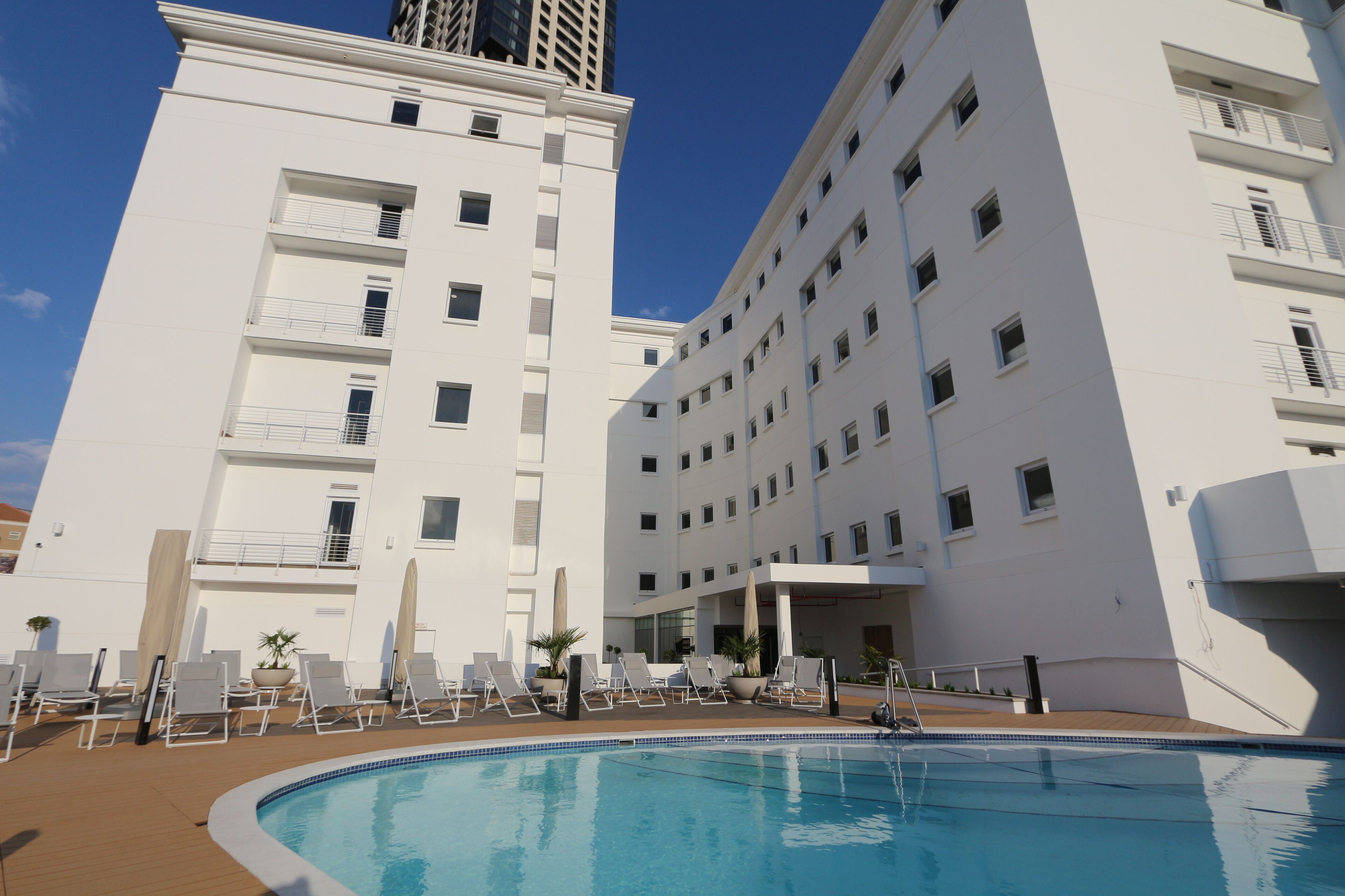 Outdoor pool, pool umbrellas, sun loungers