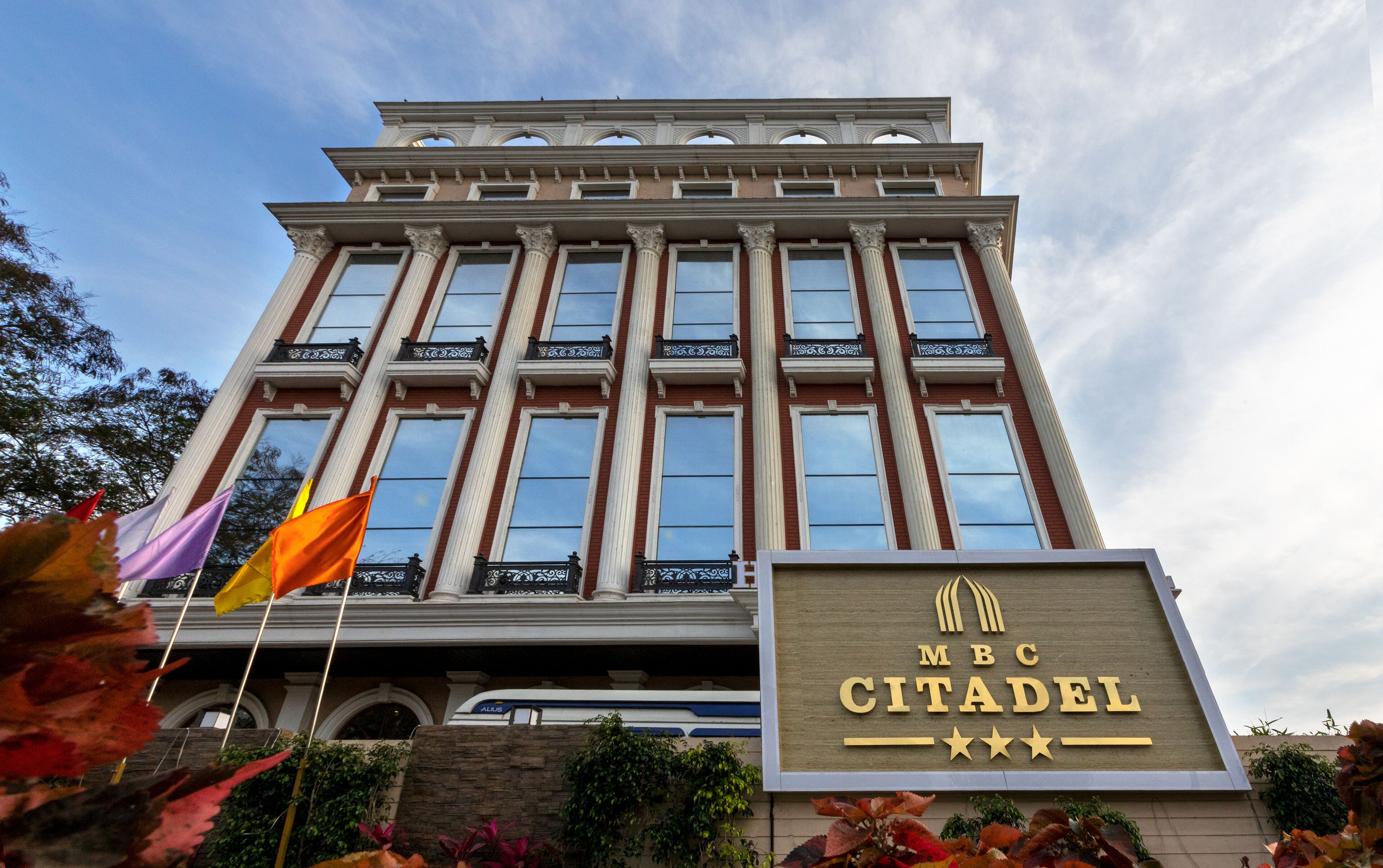 A multi-story building with a sign reading "MBC CITADEL".