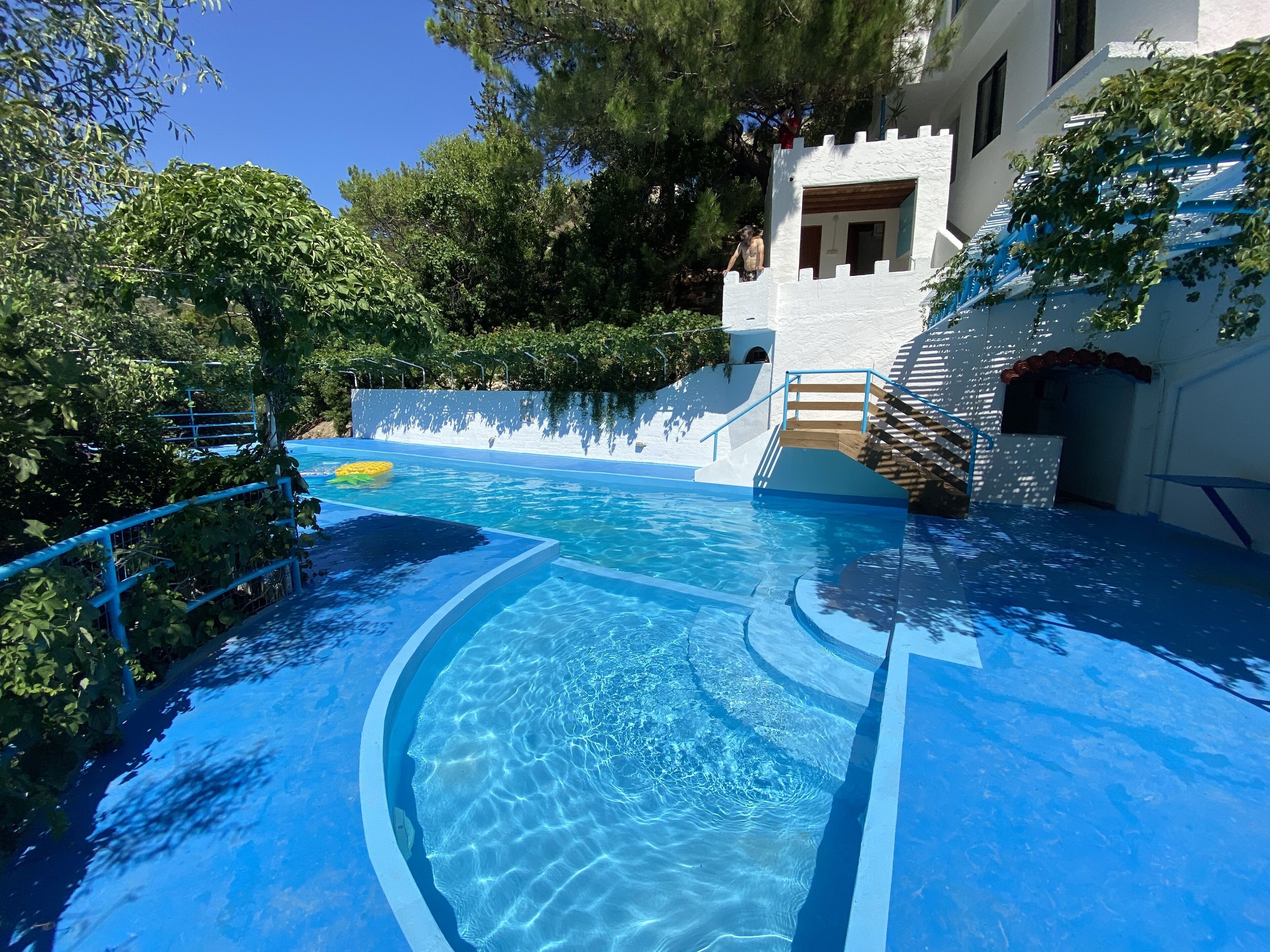 Outdoor pool, open 9:00 AM to 9:00 PM, pool umbrellas, pool loungers