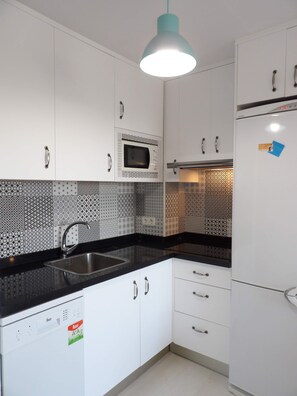 Fridge, stovetop, coffee/tea maker, cookware/dishes/utensils