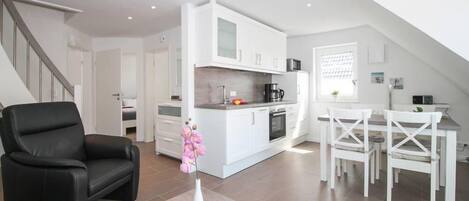 Apartment, 2 Bedrooms | Living area | Flat-screen TV, heated floors