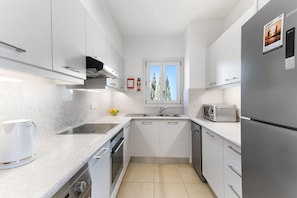 Apartment, 2 Bedrooms | Private kitchen | Full-size fridge, microwave, oven, stovetop