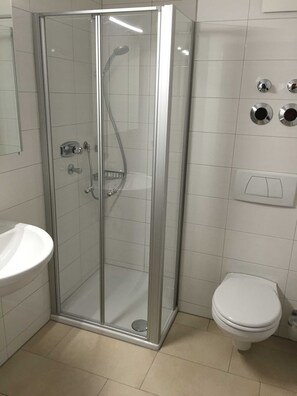 Shower, towels, soap, toilet paper