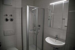 Shower, towels, soap, toilet paper