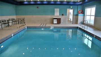 Indoor pool, open 7:00 AM to 11:00 PM, pool loungers