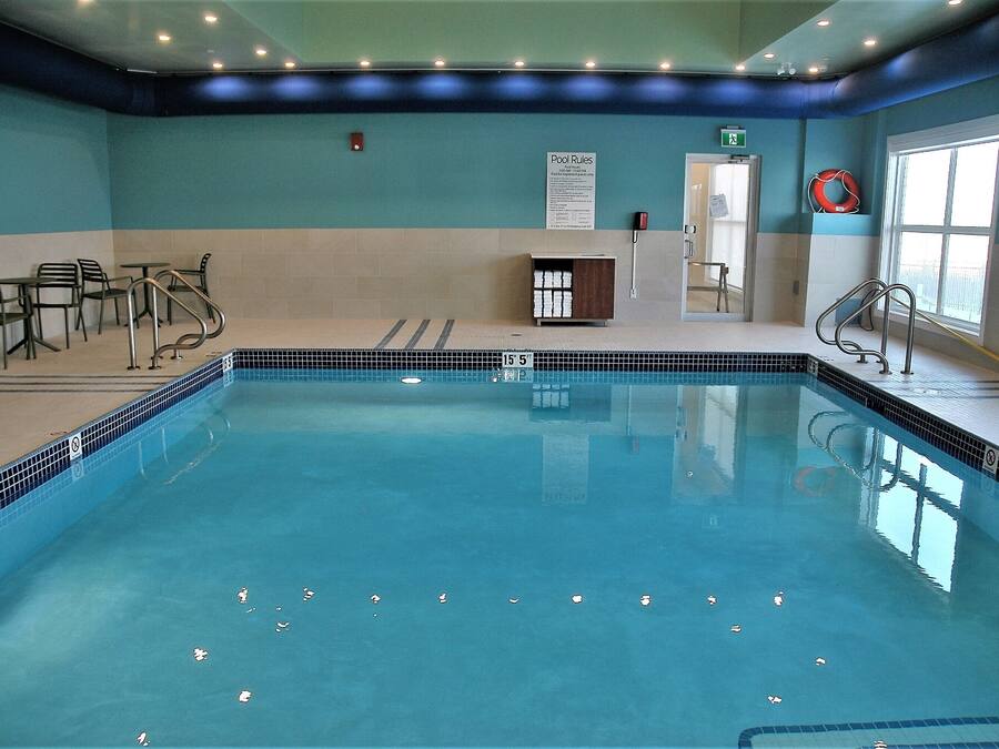 Indoor pool, open 7:00 AM to 11:00 PM, pool loungers