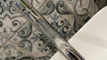 Separate bathtub and shower, hair dryer, towels, soap