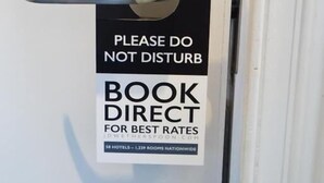 A hotel door with a 'Please Do Not Disturb' sign and a 'Book Direct for Best Rates' sign. - The Swan Hotel by Wetherspoon (Leighton Buzzard)