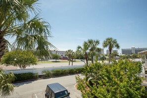 Hotel offers city views from its white facade, set amidst palm trees and a secure parking area.