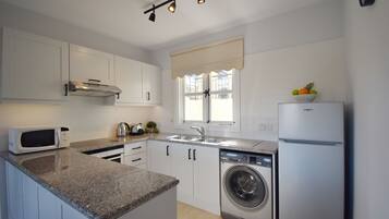 Apartment | Private kitchen | Full-sized fridge, microwave, oven, stovetop