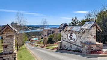 Experience the charm of The Majestic, a traditional stone building set amidst a well-maintained neighborhood with lush greenery and scenic views.