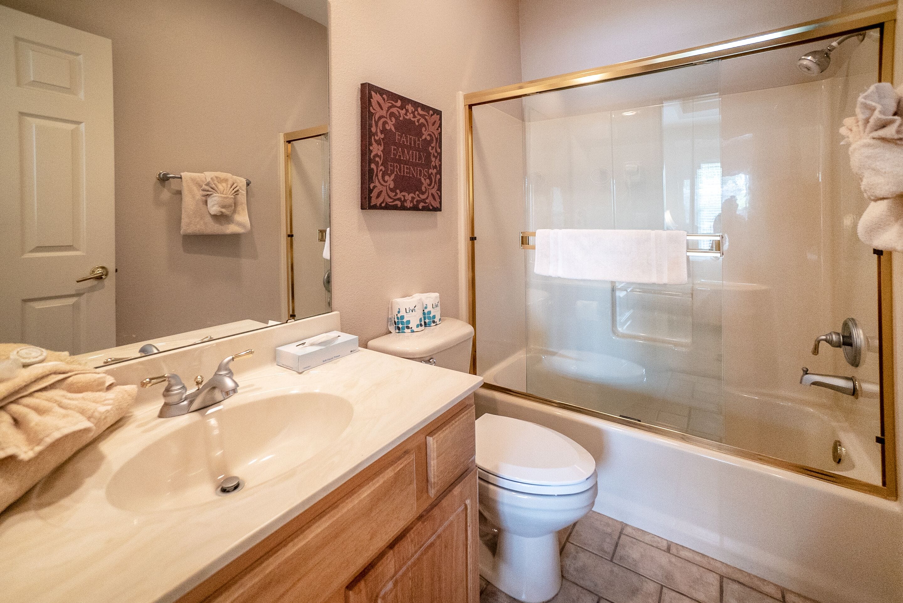 A bathroom with a sink, toilet, and bathtub.