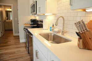 Microwave, coffee/tea maker, toaster, cookware/dishes/utensils