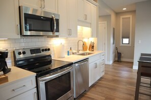 Microwave, coffee/tea maker, toaster, cookware/dishes/utensils