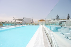 Outdoor pool, open 10:00 AM to 6:00 PM, pool umbrellas, sun loungers
