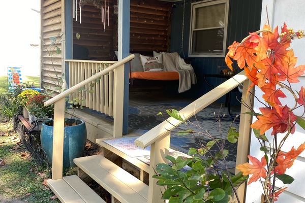 Our porch is covered and sides are slatted wood. Can sit here w/blankets!