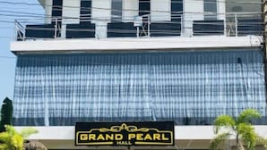 A multi-story building with a sign reading "Grand Pearl Hall". - Grand Star Guest House (Batticaloa)