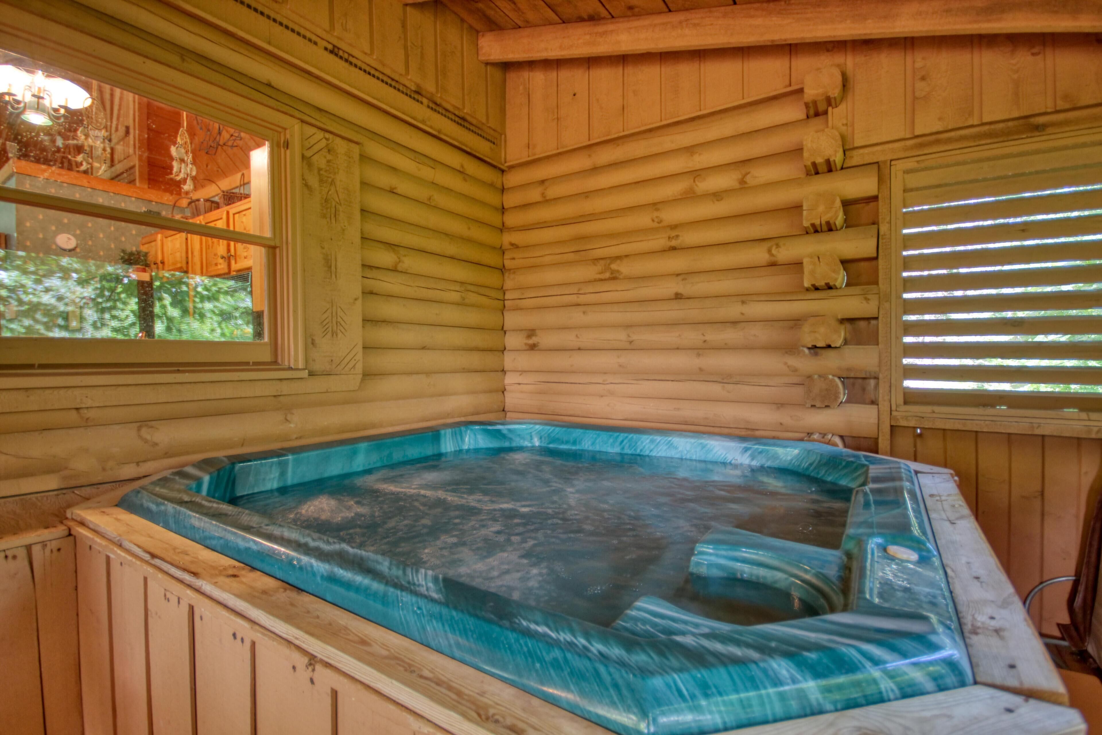 A wooden cabin with a hot tub.