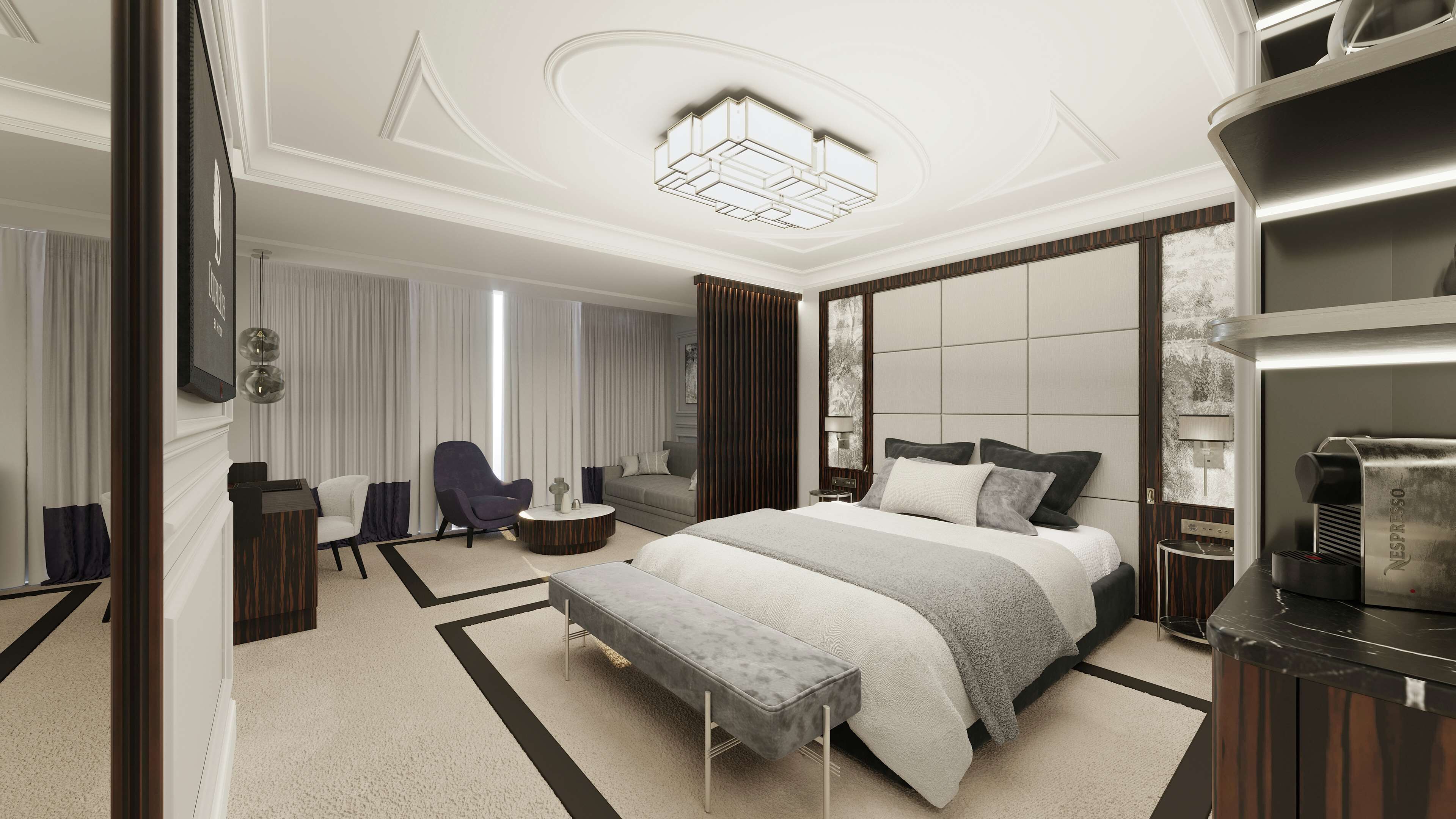 A modern hotel room with a large bed, a seating area with a sofa and armchairs, a coffee machine, and a large window with curtains.