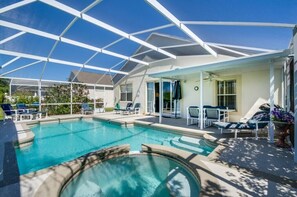 A covered outdoor swimming pool with lounge chairs and a patio area. - Northampaton Villa Highlands Reserve (Davenport)