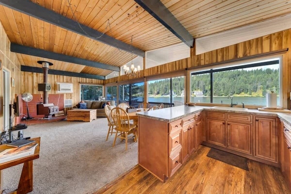 Open concept kitchen and dining area leading to living room