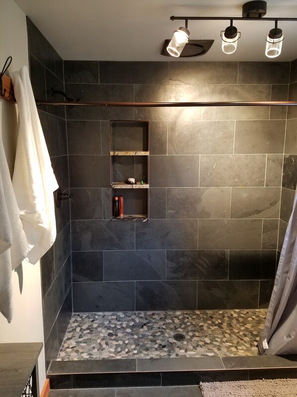 Combined shower/tub, hair dryer, towels, soap