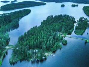 An aerial view of a forested island with a dock, surrounded by water. - Suvituuli by Interhome (Pertunmaa)