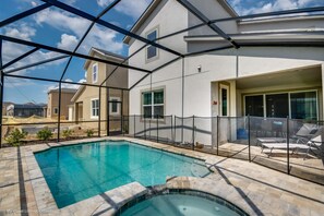 A residential property with a swimming pool, outdoor seating, and a covered patio area. - Amazing 7 Bd 5 Ba Villa Solara Resort 1600hgp (Kissimmee)
