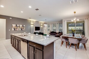 Villa | Private kitchen | Dining tables