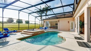 A covered outdoor swimming pool with lounge chairs and a patio area. - 354pd Golf View Villa With Spa (Davenport)